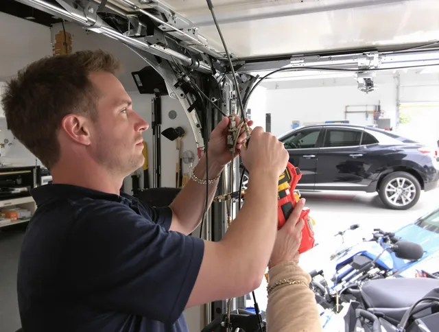 Tiverton Garage Door Repair safety certified technician performing cable replacement in Tiverton