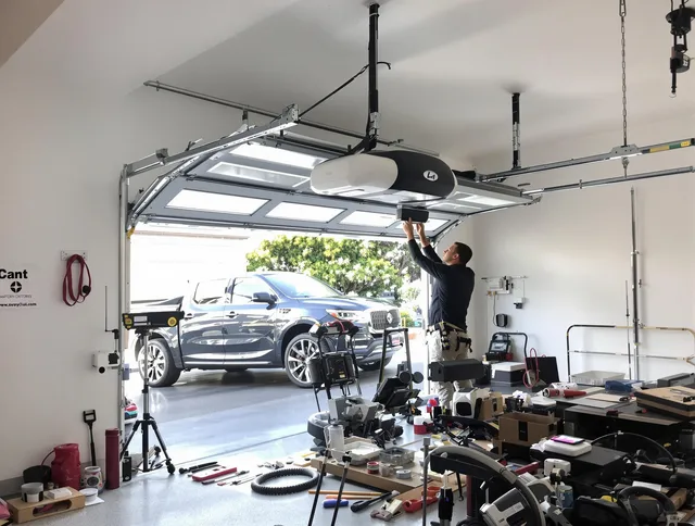 Tiverton Garage Door Repair specialist installing smart garage door opener system in Tiverton home