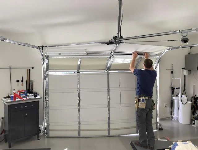 Tiverton Garage Door Repair specialist performing precise section replacement on Tiverton garage door
