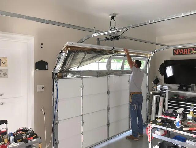Garage door section replacement by Tiverton Garage Door Repair in Tiverton